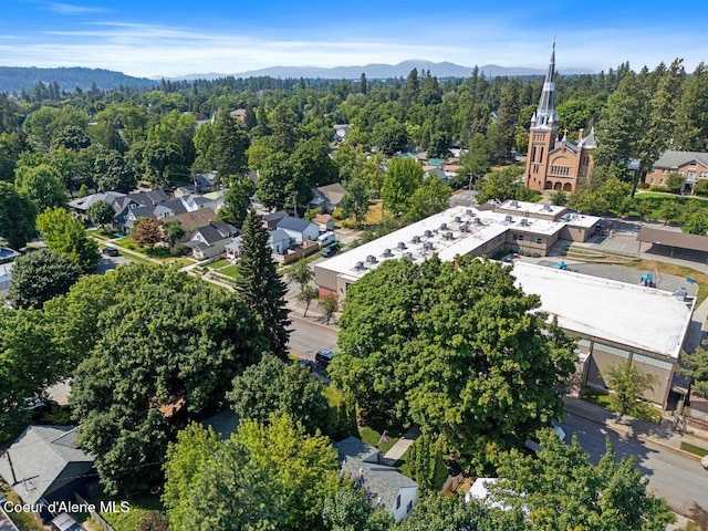 908 E Coeur D Alene Ave, Coeur Dalene, ID 83814 - aerial view of a forest and a mountainous background
