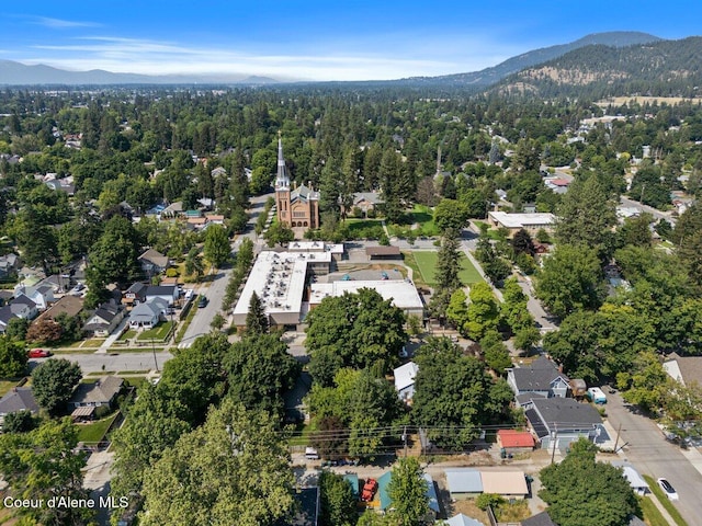 908 E Coeur D Alene Ave, Coeur Dalene, ID 83814 - view of property location featuring a mountain backdrop and a forest