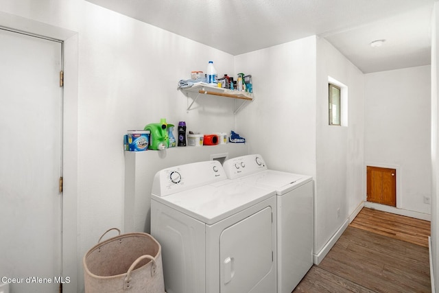 42 Bodie Ln, Priest River, ID 83856 - washroom with light wood-type flooring, washer and clothes dryer, and baseboards