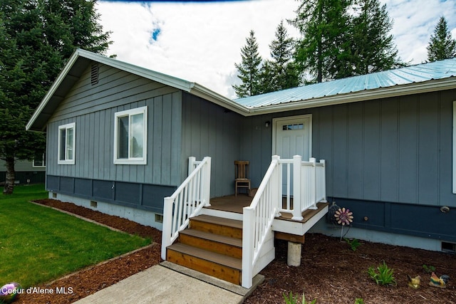 42 Bodie Ln, Priest River, ID 83856 - doorway to property with crawl space, metal roof, and a lawn