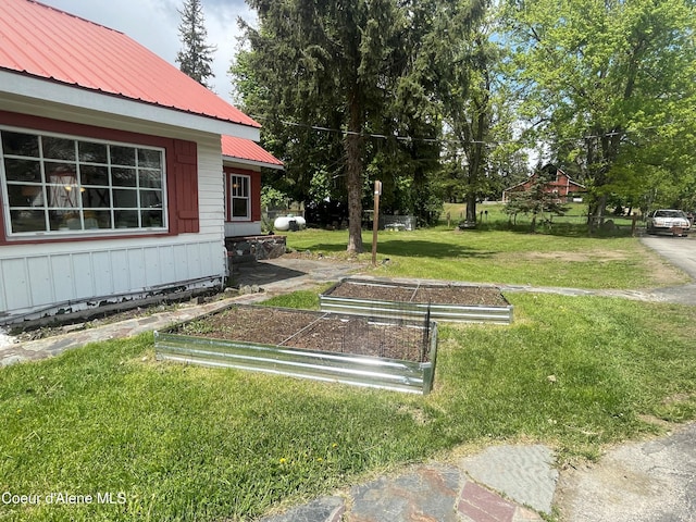 84 Highland Flats Rd, Naples, ID 83847 - view of green lawn with a garden