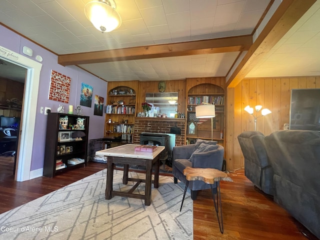84 Highland Flats Rd, Naples, ID 83847 - living area featuring beam ceiling, wood-type flooring, and wood walls