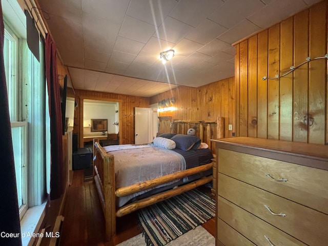 84 Highland Flats Rd, Naples, ID 83847 - bedroom featuring wood-type flooring and wood walls