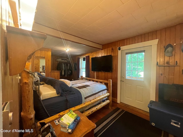 84 Highland Flats Rd, Naples, ID 83847 - bedroom featuring wood walls and wood finished floors