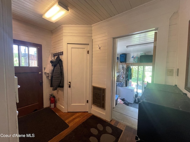 84 Highland Flats Rd, Naples, ID 83847 - foyer entrance with ornamental molding, wood finished floors, wooden walls, and wood ceiling