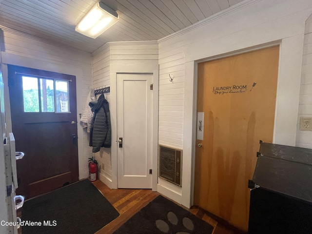 84 Highland Flats Rd, Naples, ID 83847 - entryway featuring wood finished floors, heating unit, ornamental molding, wooden walls, and wood ceiling