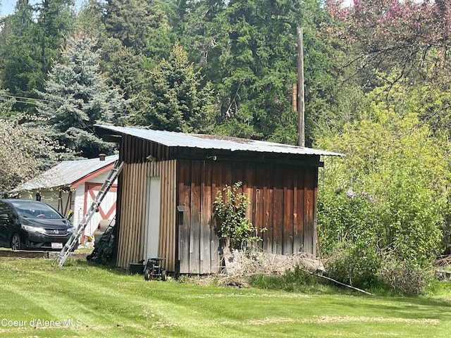 84 Highland Flats Rd, Naples, ID 83847 - view of outbuilding featuring a wooded view