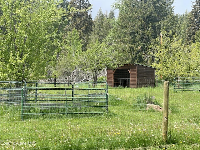 84 Highland Flats Rd, Naples, ID 83847 - gate featuring an outbuilding and a view of trees