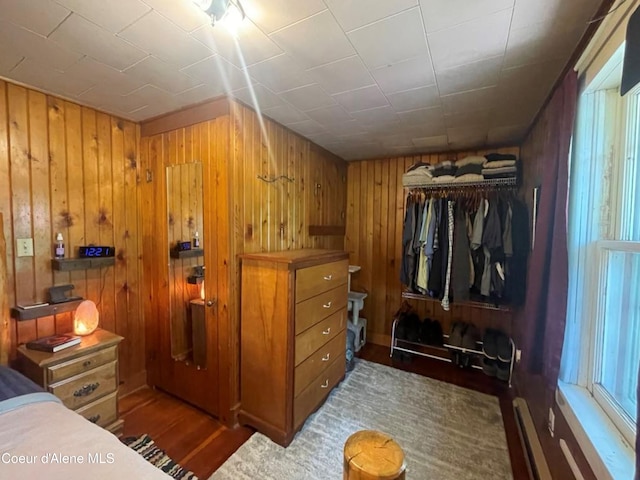 84 Highland Flats Rd, Naples, ID 83847 - bedroom with wooden walls, a closet, and wood finished floors