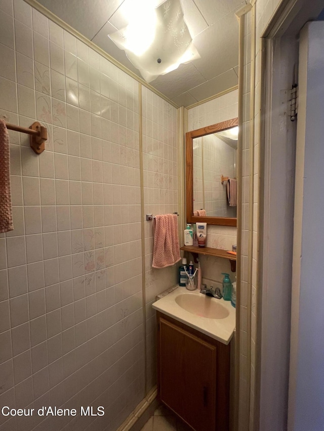 84 Highland Flats Rd, Naples, ID 83847 - bathroom featuring vanity and tile walls