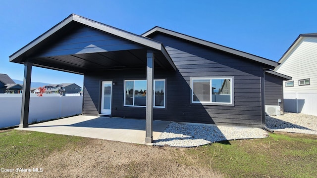 2941 N Wrenley Ln, Post Falls, ID 83854 - back of house featuring fence and a patio