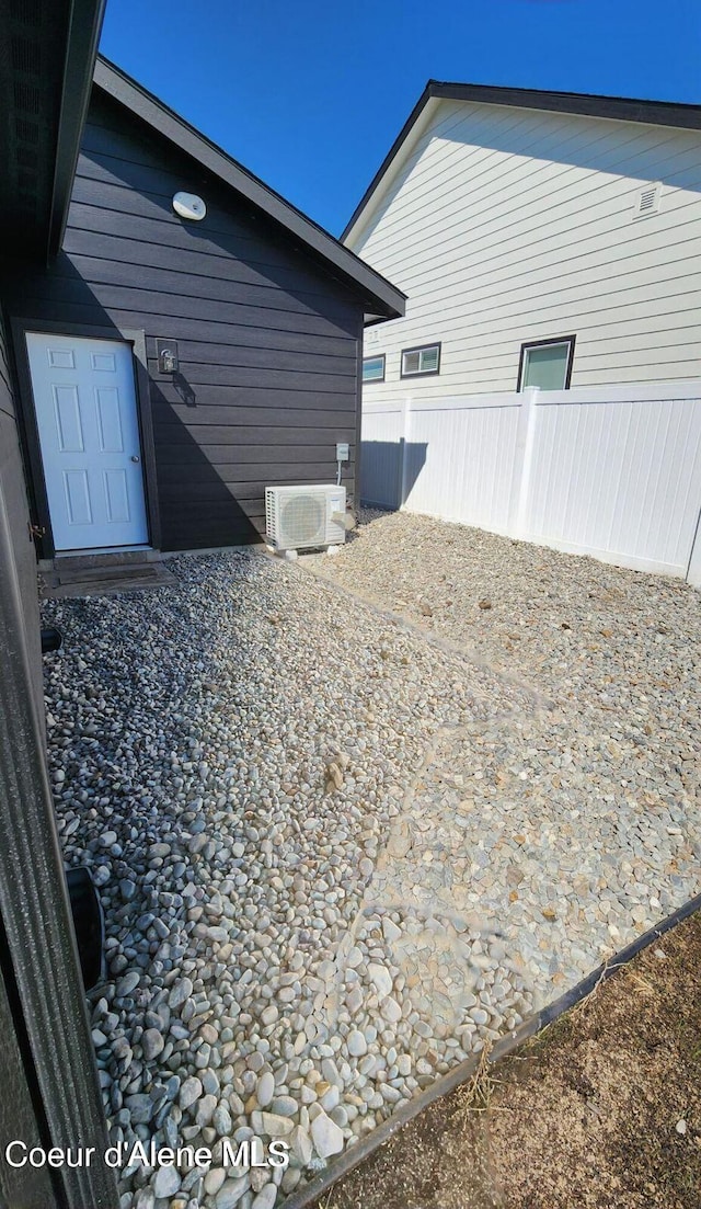 2941 N Wrenley Ln, Post Falls, ID 83854 - view of home's exterior with fence and a cooling unit