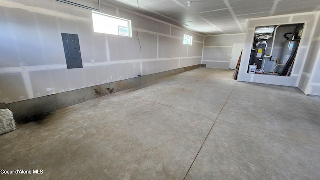 2941 N Wrenley Ln, Post Falls, ID 83854 - garage with electric panel, heating unit, and water heater