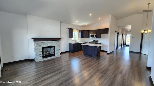 2941 N Wrenley Ln, Post Falls, ID 83854 - kitchen featuring open floor plan, stainless steel appliances, healthy amount of natural light, a kitchen island, and vaulted ceiling