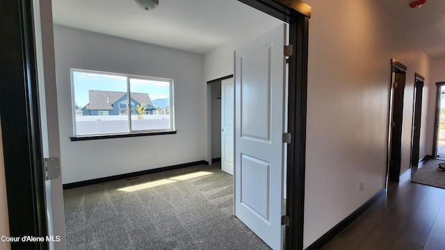 2941 N Wrenley Ln, Post Falls, ID 83854 - unfurnished bedroom with baseboards and dark carpet