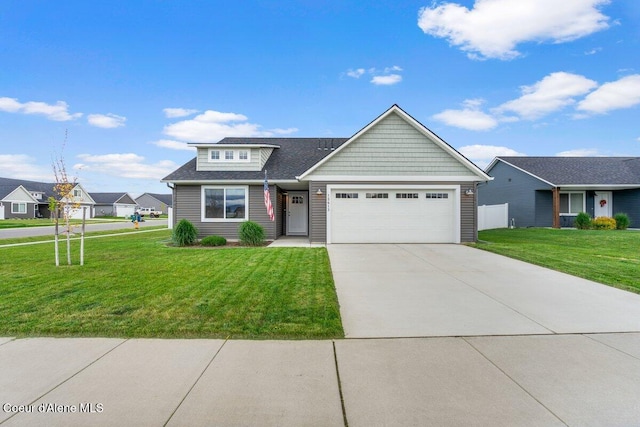 12613 N Lattner St, Rathdrum, ID 83858 - view of front of house with a garage, a front yard, concrete driveway, and roof with shingles