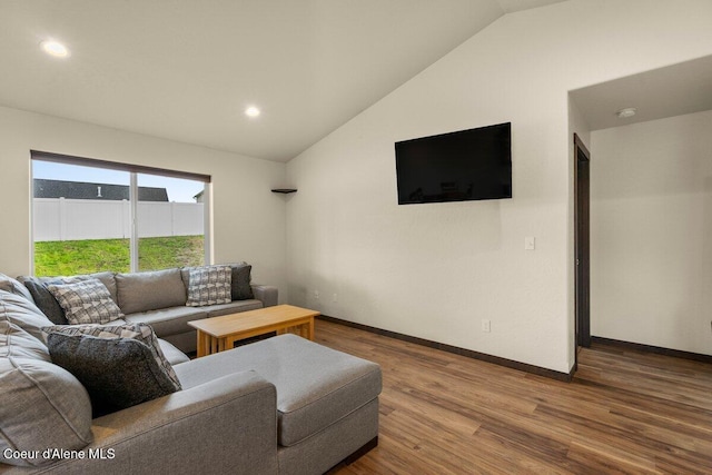 12613 N Lattner St, Rathdrum, ID 83858 - living area featuring vaulted ceiling, wood finished floors, baseboards, and recessed lighting