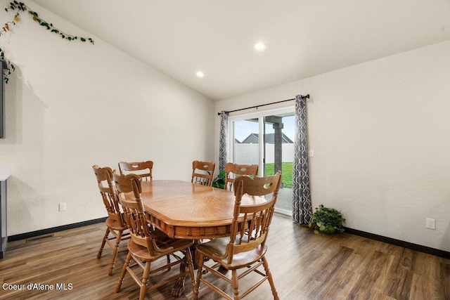 12613 N Lattner St, Rathdrum, ID 83858 - dining room with vaulted ceiling, wood finished floors, baseboards, and recessed lighting