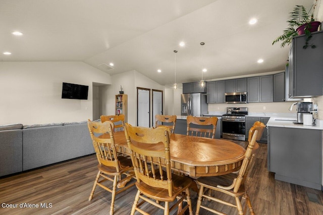 12613 N Lattner St, Rathdrum, ID 83858 - dining area featuring dark wood finished floors, vaulted ceiling, and recessed lighting