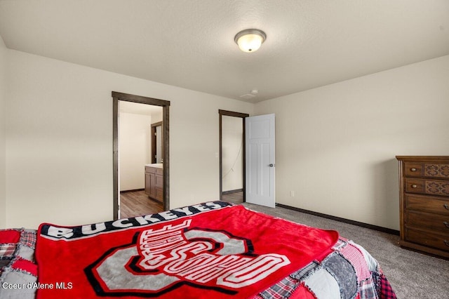 12613 N Lattner St, Rathdrum, ID 83858 - carpeted bedroom featuring baseboards and connected bathroom