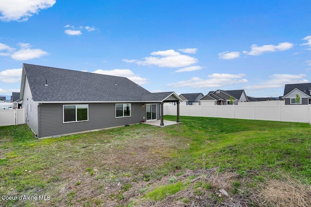 12613 N Lattner St, Rathdrum, ID 83858 - rear view of house featuring a patio and roof with shingles