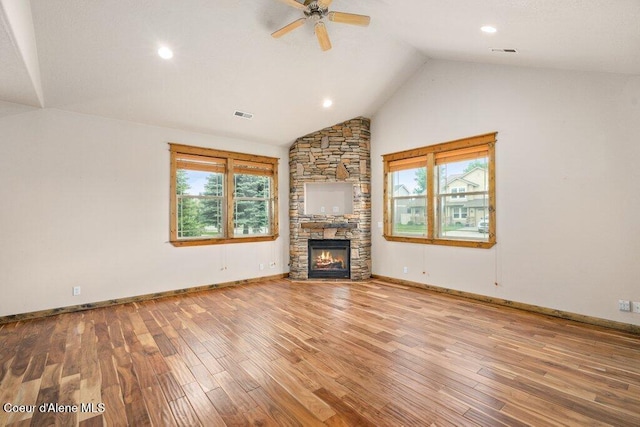15360 N Nixon Loop, Rathdrum, ID 83858 - unfurnished living room featuring a fireplace, a ceiling fan, wood finished floors, recessed lighting, and baseboards