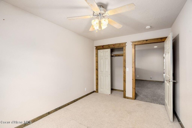 15360 N Nixon Loop, Rathdrum, ID 83858 - unfurnished bedroom with light colored carpet, ceiling fan, baseboards, and a closet