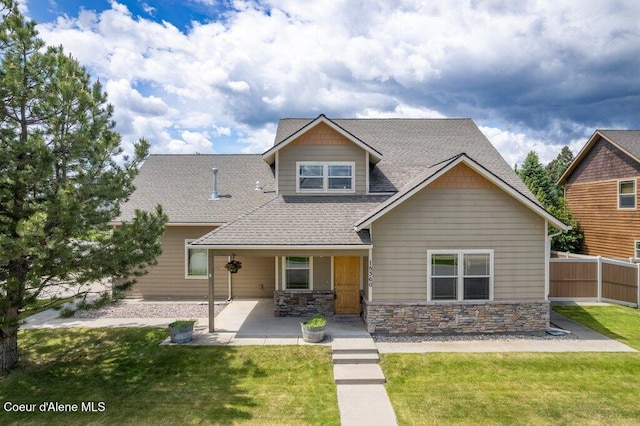 15360 N Nixon Loop, Rathdrum, ID 83858 - craftsman inspired home with a shingled roof, a patio area, and stone siding