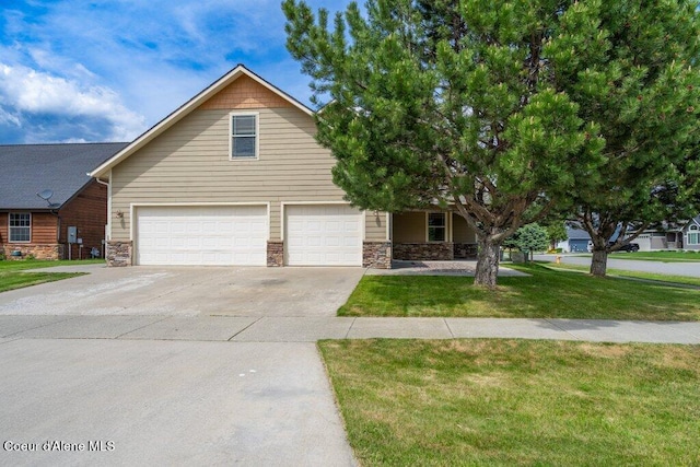 15360 N Nixon Loop, Rathdrum, ID 83858 - view of front of house featuring an attached garage, driveway, stone siding, and a front yard
