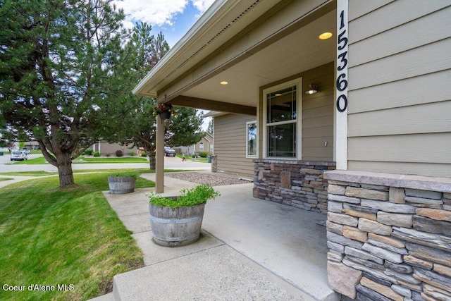 15360 N Nixon Loop, Rathdrum, ID 83858 - covered porch featuring a yard