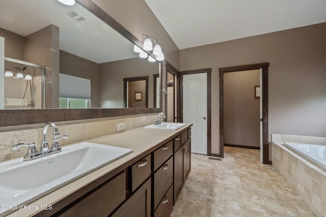 29264 N Ramsey Rd, Athol, ID 83801 - full bathroom with a stall shower, double vanity, and a relaxing tiled tub
