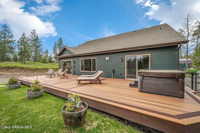 29264 N Ramsey Rd, Athol, ID 83801 - back of house with a hot tub, roof with shingles, a lawn, and a deck
