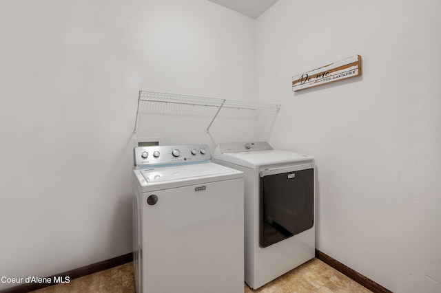 29264 N Ramsey Rd, Athol, ID 83801 - washroom featuring washing machine and clothes dryer and baseboards
