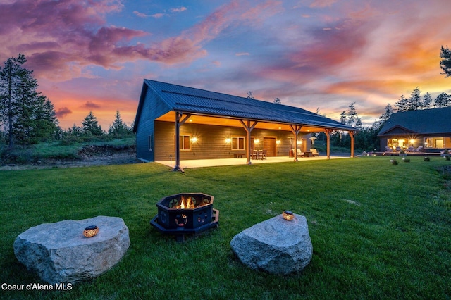 29264 N Ramsey Rd, Athol, ID 83801 - view of grassy yard featuring a fire pit and a patio