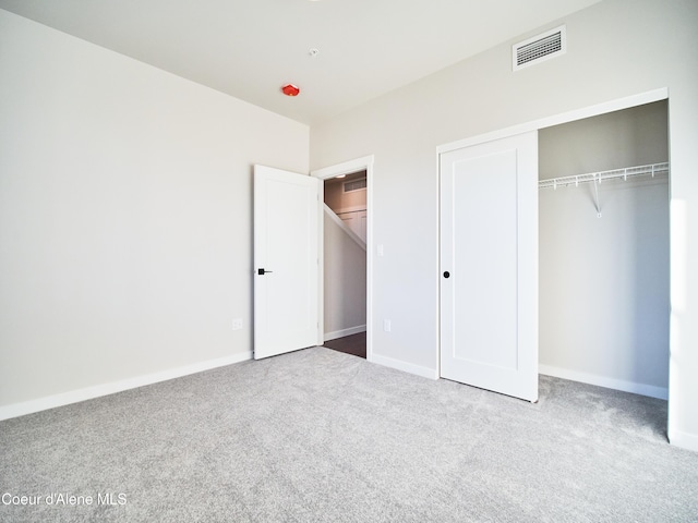 898 E Railroad Ave, Post Falls, ID 83854 - unfurnished bedroom featuring carpet flooring, a closet, and baseboards