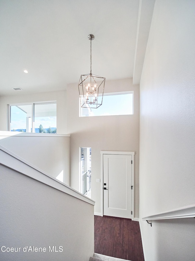 898 E Railroad Ave, Post Falls, ID 83854 - entryway with a chandelier, wood finished floors, recessed lighting, baseboards, and a high ceiling