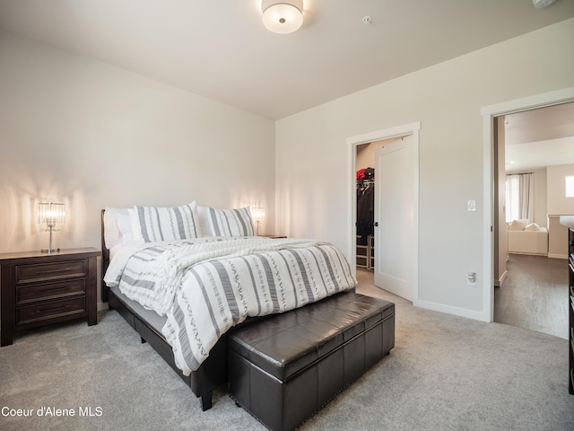 898 E Railroad Ave, Post Falls, ID 83854 - bedroom with carpet flooring, baseboards, a walk in closet, and a closet