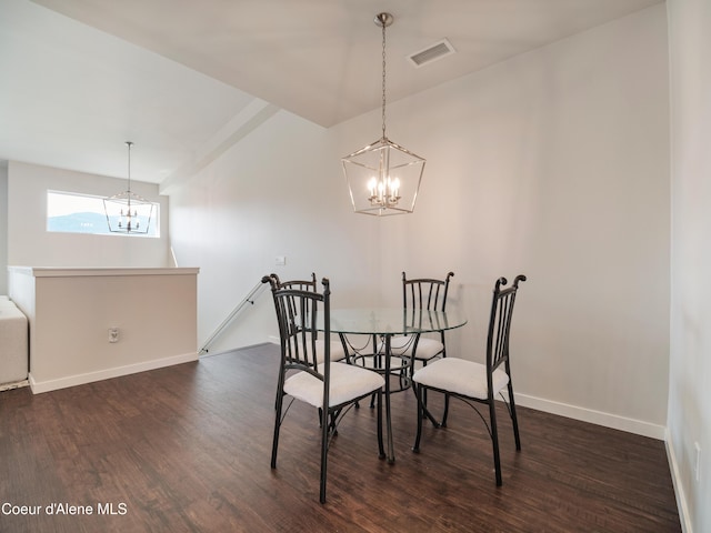 898 E Railroad Ave, Post Falls, ID 83854 - dining space with a chandelier, dark wood-type flooring, and baseboards