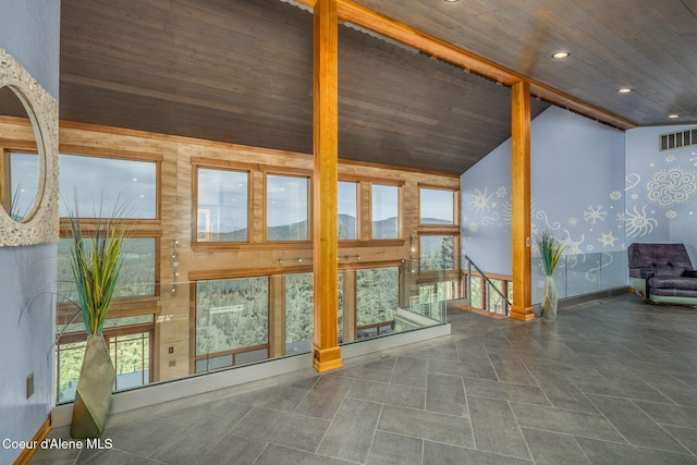23 S Lightning Spur Ln, Coeur Dalene, ID 83814 - unfurnished living room featuring wooden ceiling, high vaulted ceiling, baseboards, and recessed lighting