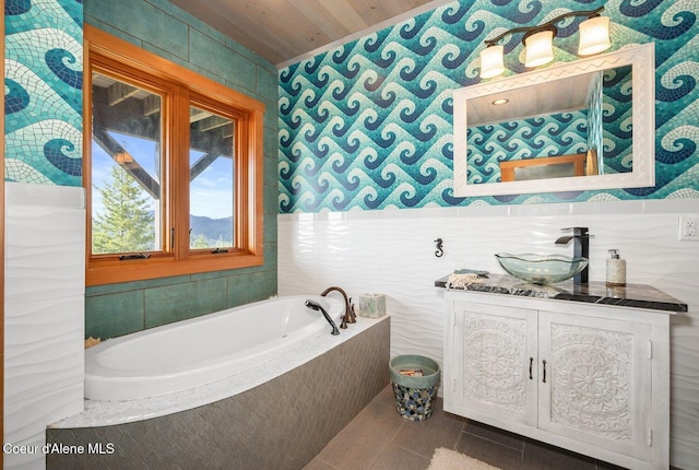 23 S Lightning Spur Ln, Coeur Dalene, ID 83814 - bathroom featuring a garden tub, vanity, tile patterned flooring, and wood ceiling