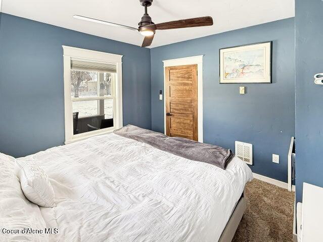 372 E Jefferson Ave, Priest River, ID 83856 - bedroom with carpet floors, ceiling fan, and baseboards