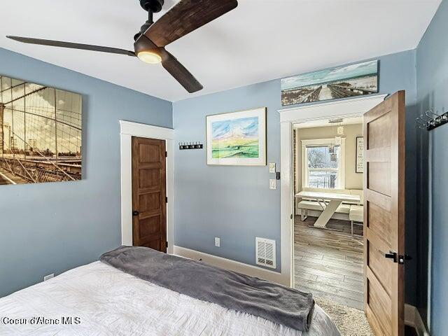 372 E Jefferson Ave, Priest River, ID 83856 - bedroom with wood finished floors, ceiling fan, and baseboards