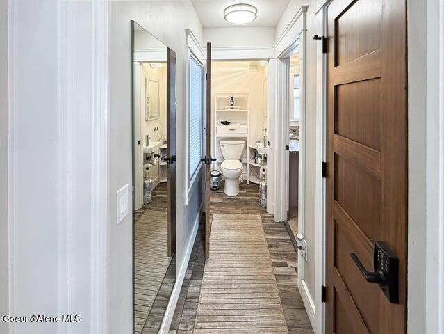 372 E Jefferson Ave, Priest River, ID 83856 - hall featuring dark wood-style floors and baseboards