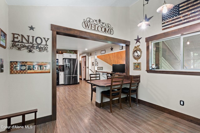 3470 W Seasons Rd, Rathdrum, ID 83858 - dining room featuring wood finished floors, baseboards, and a high ceiling