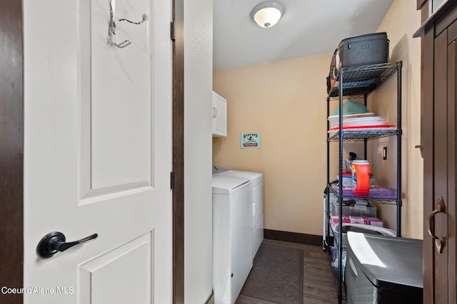3470 W Seasons Rd, Rathdrum, ID 83858 - laundry room with cabinet space, washing machine and clothes dryer, dark wood finished floors, and baseboards