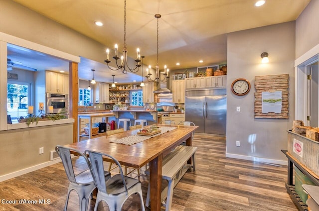 348 Kootenai Trail Rd, Naples, ID 83847 - dining area featuring a chandelier, recessed lighting, baseboards, and dark wood finished floors