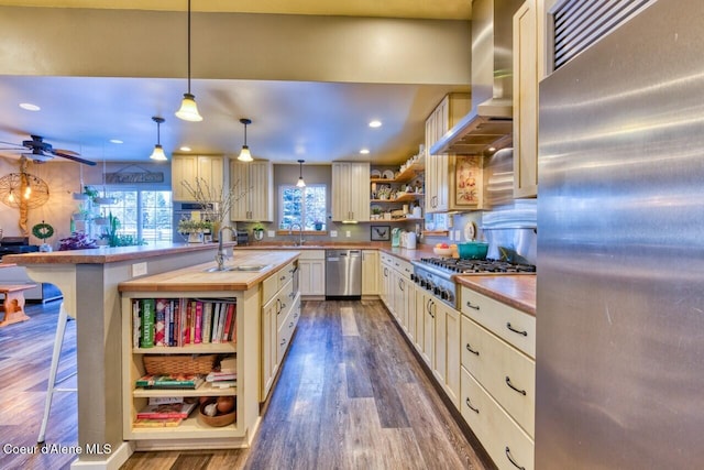 348 Kootenai Trail Rd, Naples, ID 83847 - kitchen with appliances with stainless steel finishes, open shelves, wood counters, wall chimney exhaust hood, and a sink