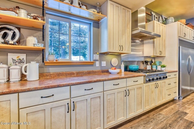 348 Kootenai Trail Rd, Naples, ID 83847 - kitchen featuring wall chimney exhaust hood, appliances with stainless steel finishes, open shelves, and light wood-type flooring