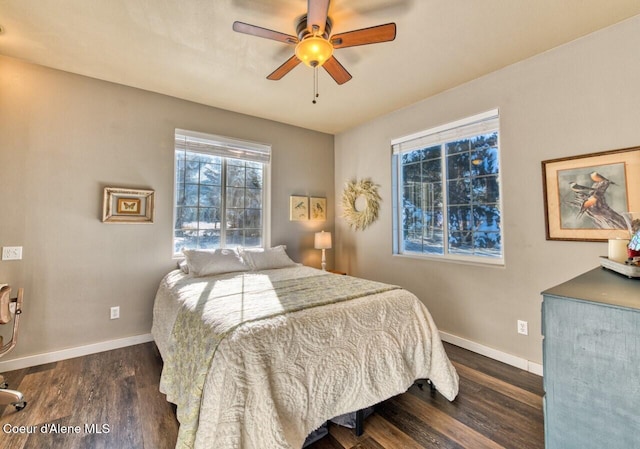 348 Kootenai Trail Rd, Naples, ID 83847 - bedroom with dark wood-type flooring, baseboards, and a ceiling fan