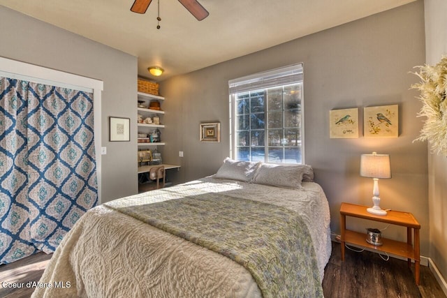 348 Kootenai Trail Rd, Naples, ID 83847 - bedroom with wood finished floors, a ceiling fan, and baseboards